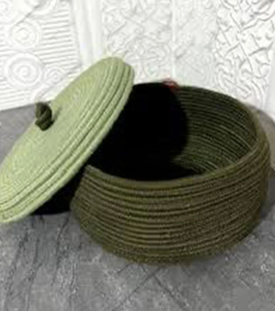 Decorative braided storage basket with lid for storing essentials while enhancing home organization