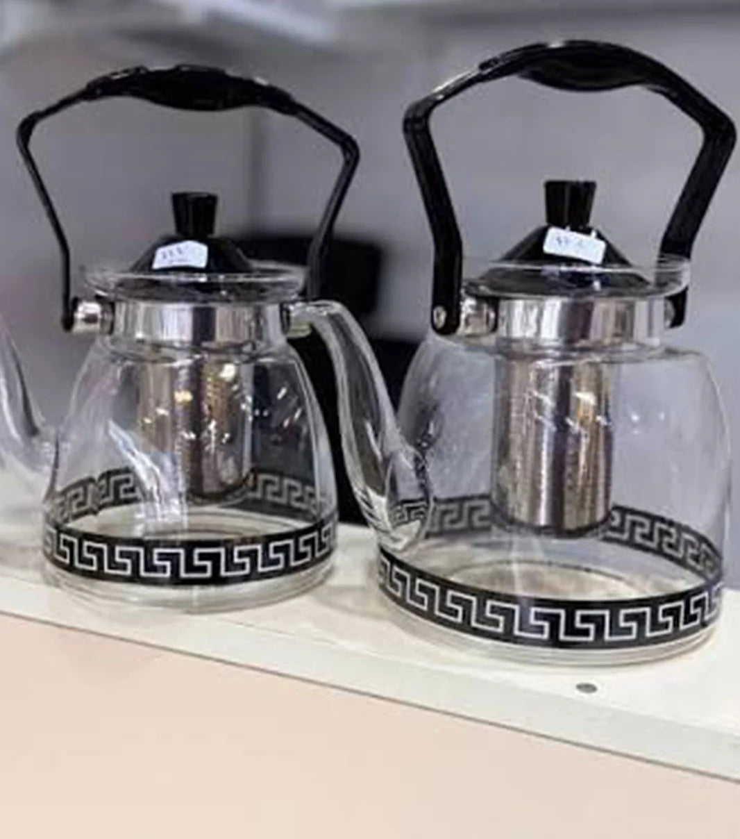 Transparent glass tea kettle for stove with heat resistant handle and modern design