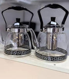 Transparent glass tea kettle for stove with heat resistant handle and modern design